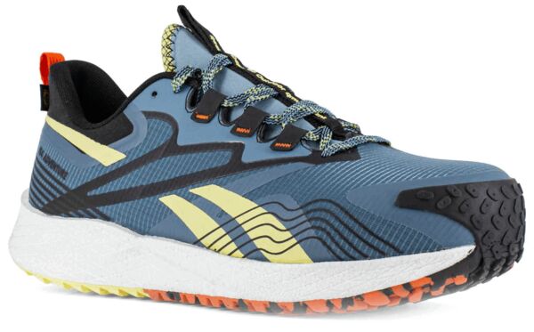 The shoe is sporty, with a blue upper and yellow and black details. The sole is thick and provides good grip. The laces are in a lighter shade with a textured structure.