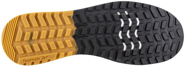 The image shows the sole of a sports shoe. The sole features a yellow and black rubber blend with a textured tread and several grooves for improved grip.