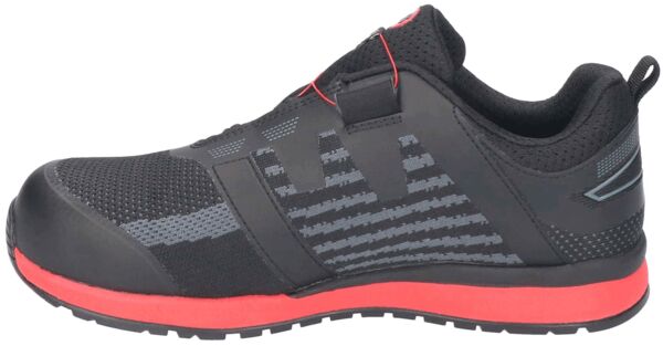 The shoe is sporty and black with red accents. The surface is made of breathable material, with textured patterns. It has a flat, non-slip sole.