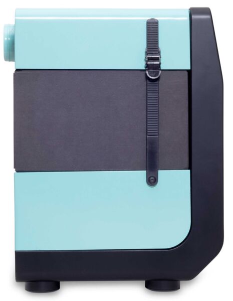 The image depicts a compact refrigerator in a modern design. It features a top light blue surface, a gray middle, and a black lower section with round feet. A durable strap binding is attached.