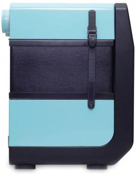 The image shows a compact, bulbous suitcase in aqua and black colors. It has a black carrying strap, a round outlet on top, and a smooth surface that looks modern.