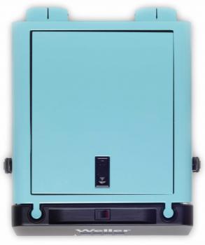 The image displays a rectangular, turquoise device with a black lower section. It features a large, closed front surface and a switch in the center. The marking "Weller" is visible.