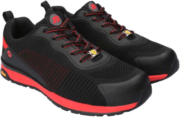 The image shows a pair of athletic shoes. They are primarily black with red accents. The surface is made of a breathable material, and the sole is sturdy with a tread.