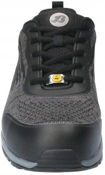 The image shows a black athletic shoe with a knitted upper and a sturdy rubber sole. It has laces and a logo on the tongue. The shoe is designed to be modern and sporty.