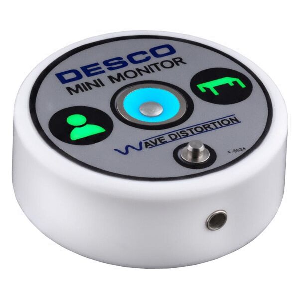 The image shows a round, white device with a smooth, metallic-blue button in the middle. Above are two green symbols for users and another symbol next to them. Text is printed on it.