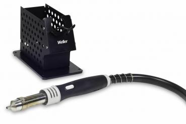 The image shows a soldering station with a soldering iron and a black holder with holes. The iron has a sturdy handle and a flexible cable.