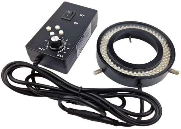 The image displays a ring light with a control unit. The control unit features an on/off switch and a dimmer. The ring light is circular with LED lights and includes a cable.