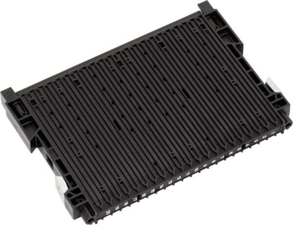 The image shows a rectangular, black component with several parallel grooves and connections on the bottom. It appears to be made of plastic and is flat.