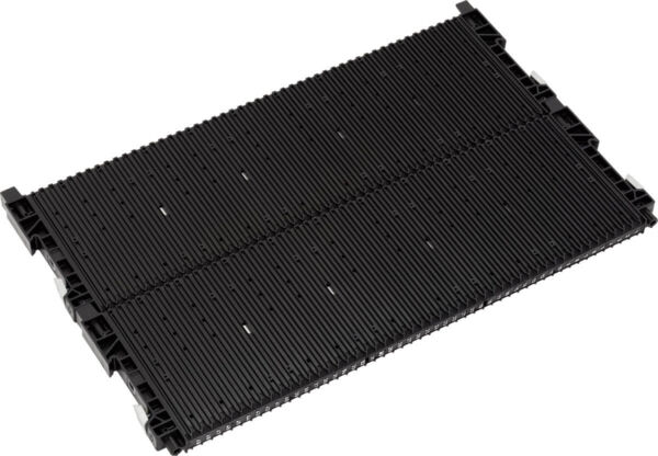 The image shows a black, rectangular structure made of plastic. It is divided into two equal halves and has a ridged surface with parallel grooves.