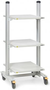 The image shows a mobile shelving unit with three white shelves. The frame is made of silver metal and has four wheels, two of which have brakes.