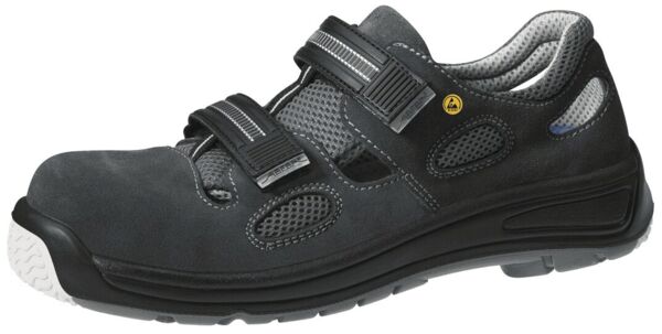 The shoe is black with breathable mesh and Velcro closures. It has a strong, non-slip sole and provides stable support, ideal for leisure and sports activities.