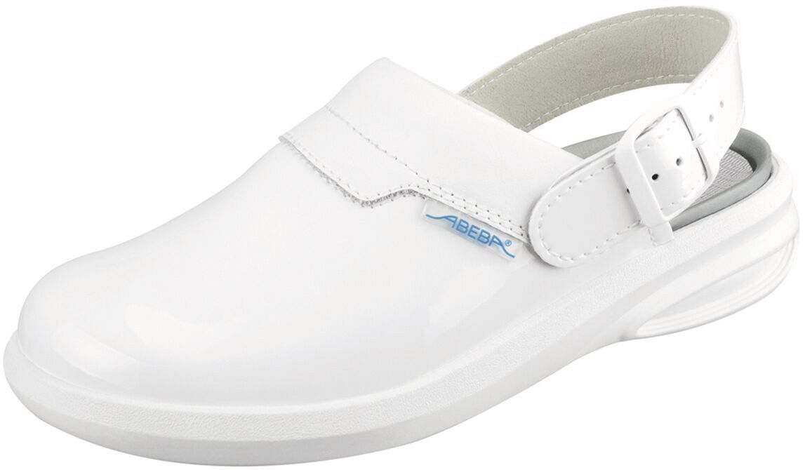 The image shows a white clog shoe with a wide, flat front part and an adjustable strap at the heel. The shoe has a clear, simple shape and a thick sole base.