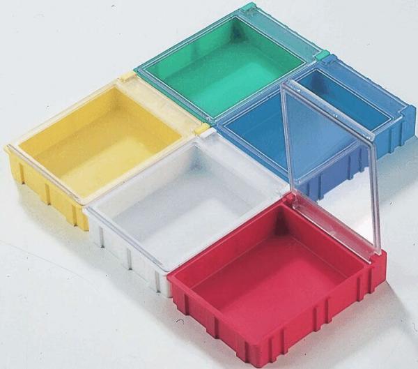 The image displays six rectangular containers in various colors: Yellow, Green, Blue, Transparent, Red, and an invisible, gray one. They are connected at the edges and slightly elevated.