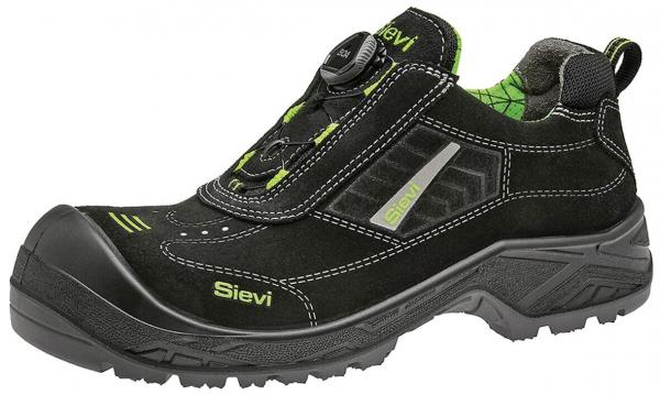 The shoe is black and has green accents. It features a smooth surface with a high shoe collar and a rubber sole. A special feature is the quick-release system on the top.