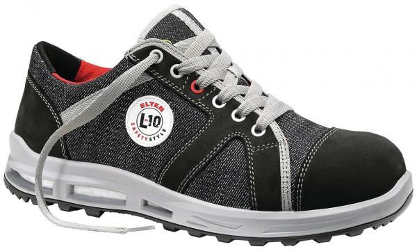 The shoe is a black safety shoe made from robust material with gray shoelaces and a white sole. It features a padded insole and is versatile.