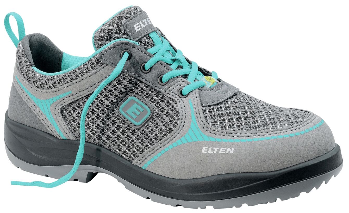 The shoe is a gray safety or work shoe with mesh material and aqua-blue accents. It has laces and a grippy, black outsole.