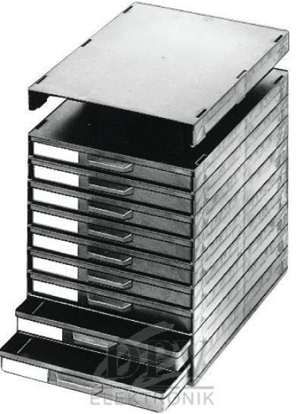 The image shows a stackable drawer cabinet with multiple drawers. The drawers are narrow and wide, the top one is open. The cabinet has a rectangular shape and stands on a stable base.