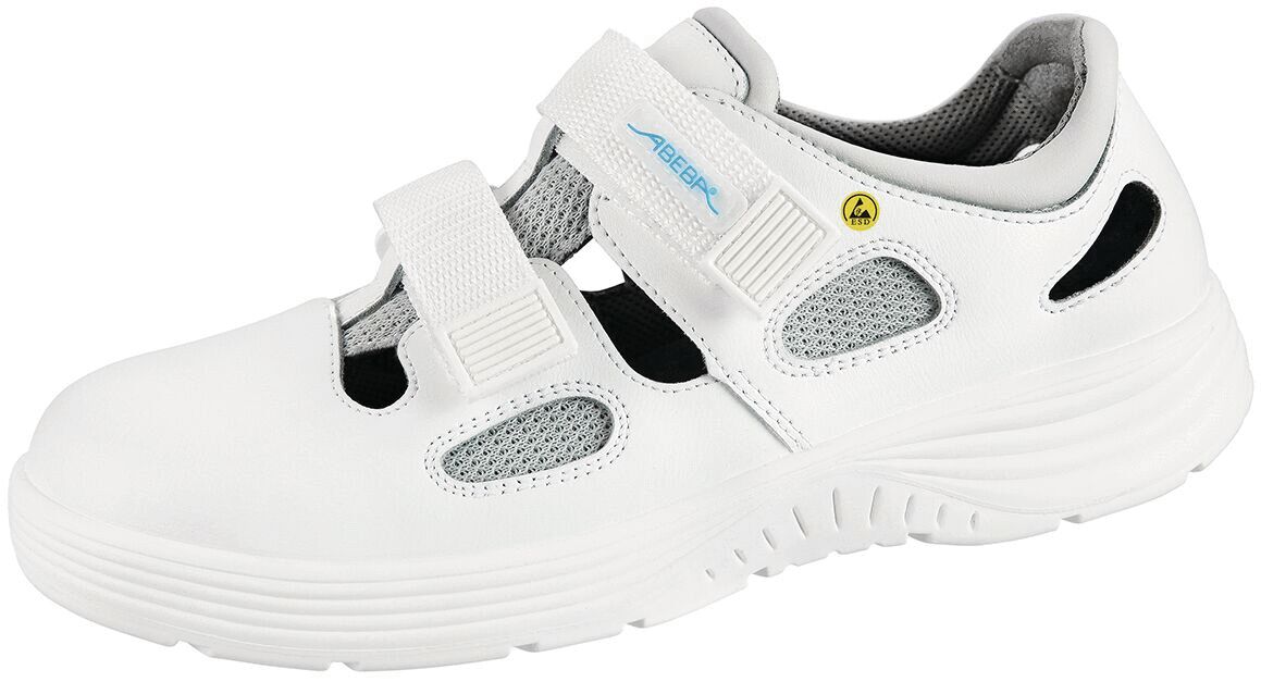 The shoe is white with a closed, yet ventilated design. It has two wide Velcro straps and a non-slip, textured sole. The inside is padded.