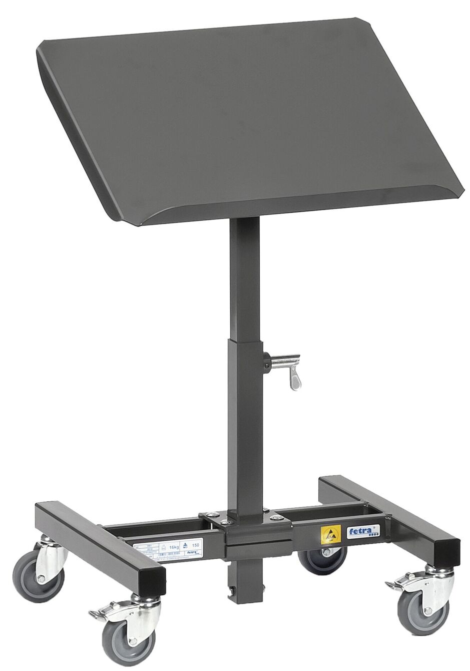 The image shows a mobile, adjustable table on wheels. The tabletop is slanted and rectangular, the stand is black and can be adjusted in height.