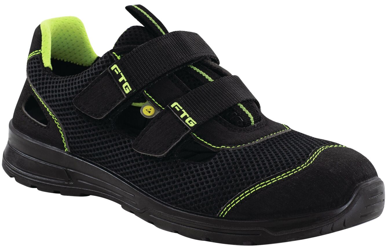 The shoe is black, has a breezy structure, and bright green accents. It is fastened with two wide Velcro straps and has a grippy, black sole.