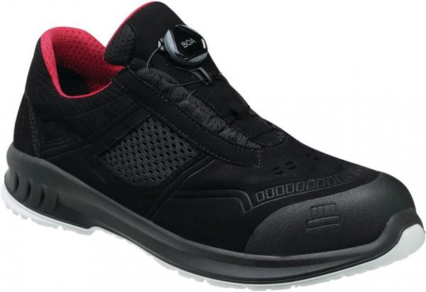 The shoe is black with red accents. It has a sporty design, a ventilated upper, and a perforated surface. Instead of laces, there is a convenient twist closure.