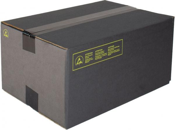 The image shows a rectangular, black cardboard box that is sealed on the top with two wide strips of tape. On one side, there is a yellow label with text.