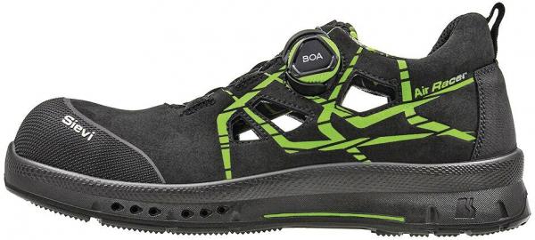 The image shows a black safety shoe with green accents. It has a sturdy, non-slip sole and a quick lacing system. The shoe is suitable for work or outdoor use.