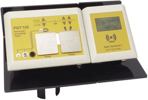 The image shows an electrical testing device with two rectangular buttons, a display on the right side, and symbols for various functions. The color is primarily yellow and black.