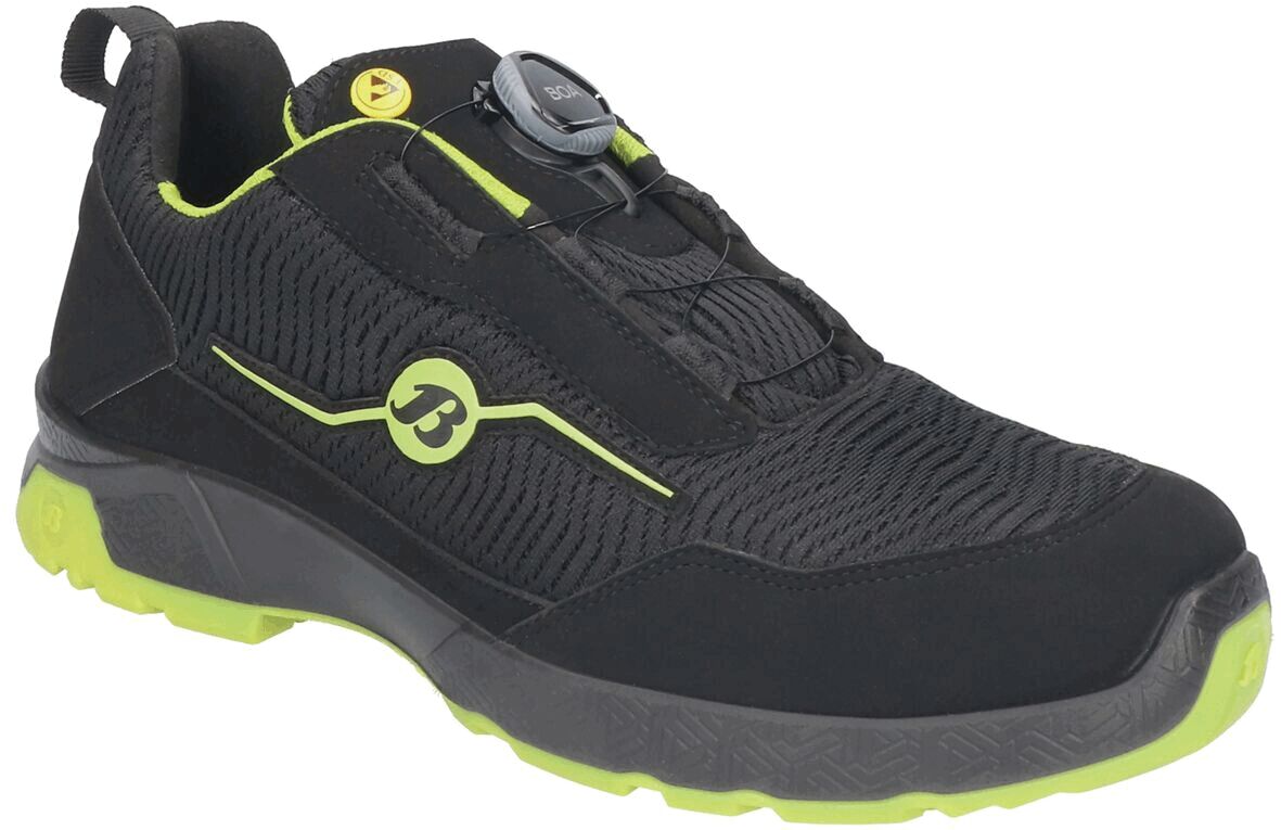 The shoe is black with a modern, breathable upper. It has a green sole and a sneaker design. The lacing is done through a practical BOA system.