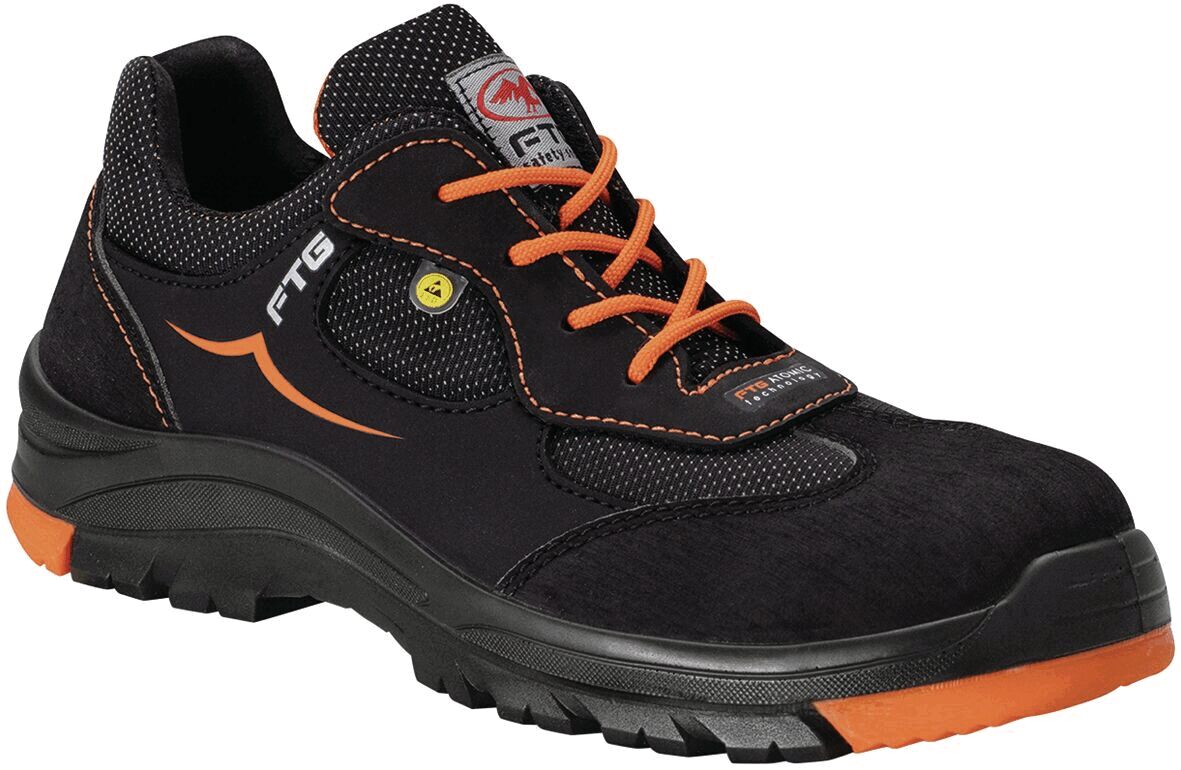 The shoe is a sporty safety shoe in black with orange accents. It has a sturdy sole, laces, and is suitable for use at work.