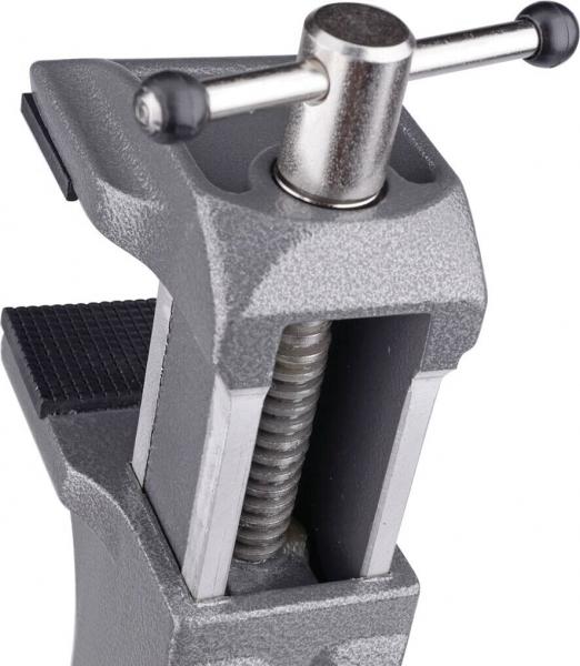 The image shows a gray metal clamp. It has a square shape with a rotatable screw on top and a clamp on the open side, which is used for holding materials.