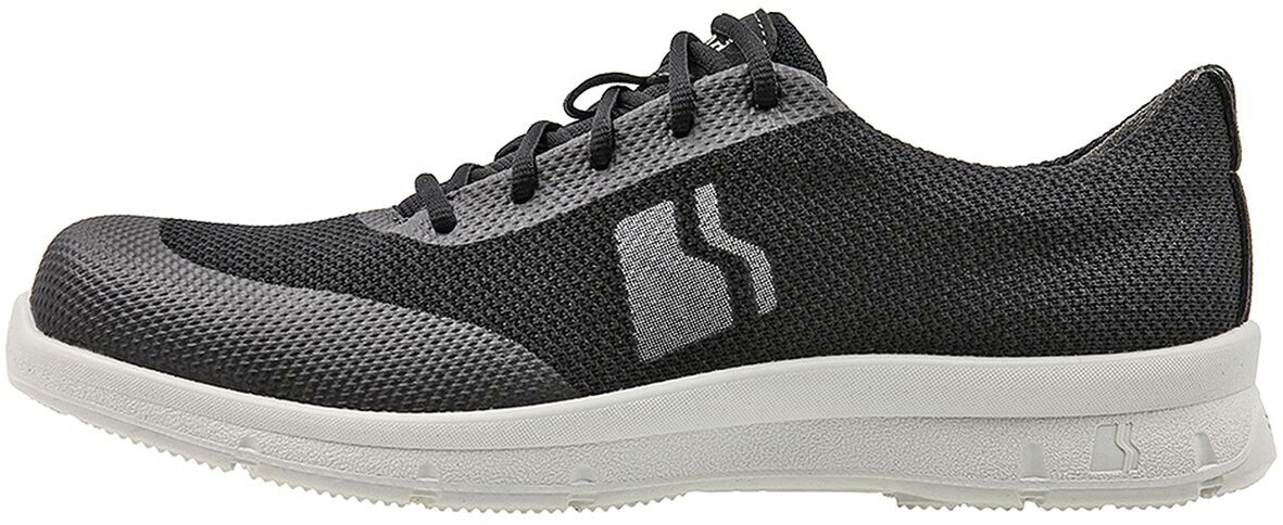 The shoe is sporty, made of lightweight, black mesh material with gray accents. It features a white, flexible sole and laces. The shape is modern and sleek.