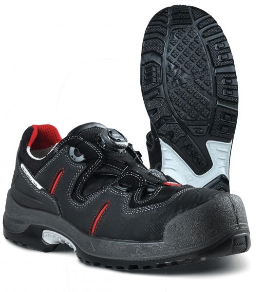 The image shows a black work shoe with red lining. It has a reinforced toe and a non-slip sole. The lacing system is equipped with a twist lock.