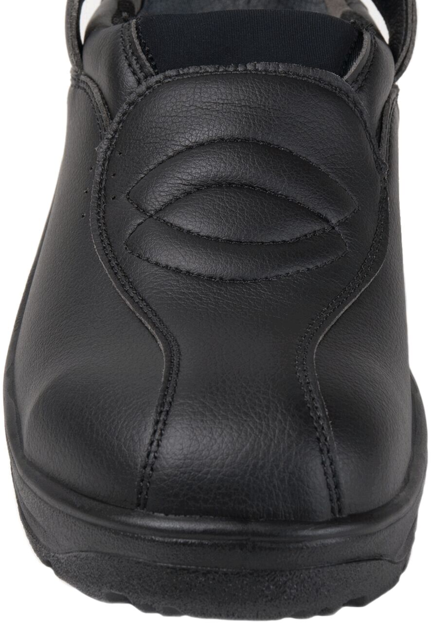 The image shows a black, closed leather shoe. The surface is smooth with a simple, modern design and a slight tread sole. The shoe has no laces.