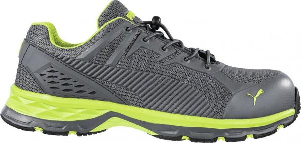 The shoe is sporty, in gray with bright green accents. It has a breathable surface, a cushioned sole, and a reinforced toe cap for protection.