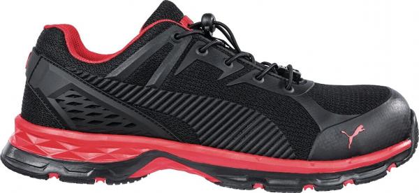 The shoe is sporty, predominantly black with red accents. It features a breathable upper and a thick, cushioned sole for comfort and grip. Ideal for active use.