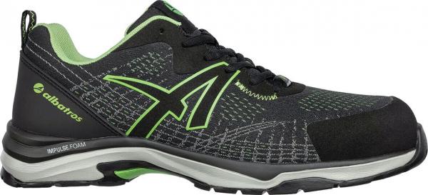 The shoe is black with green accents. It has a sporty, lightly padded shape and a non-slip sole. The laces run through braided eyelets. Comfortable and functional.