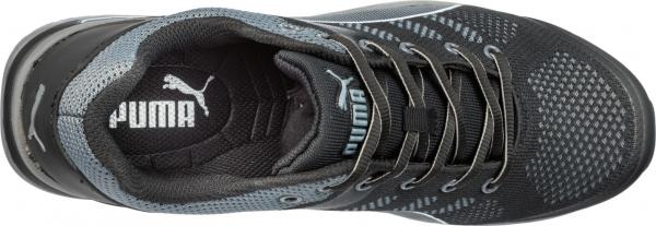 The image shows a sporty, black shoe from Puma. It features a breezy upper with gray accents and five eyelets for laces. The sole is stable.