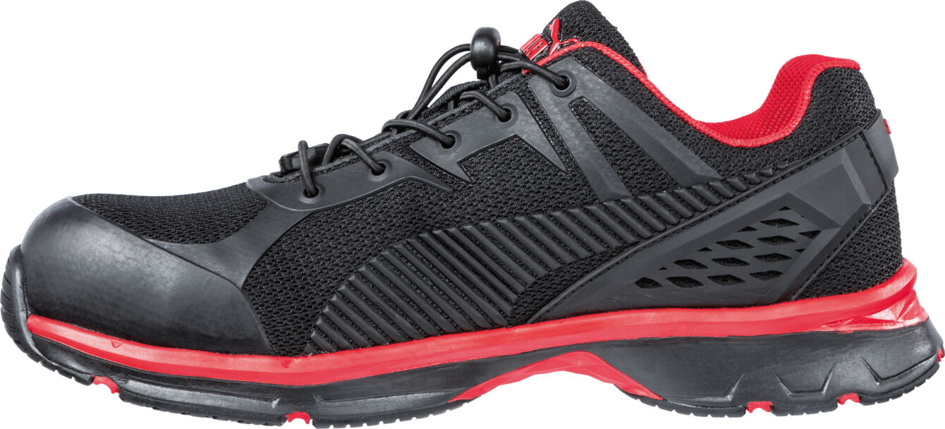 The shoe is lightweight and sporty, primarily black with red accents. It has a textured surface and breathable mesh inserts, ideal for outdoor activities.