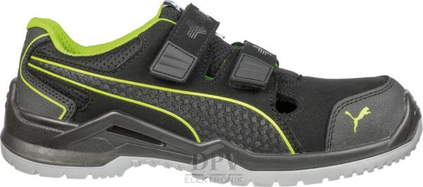 The shoe is sporty and primarily black with green accents. It has two Velcro straps and a sturdy rubber sole. The front features ventilation slots for good airflow.