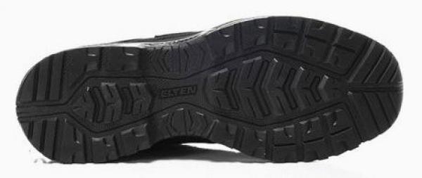 The image shows the sole of a shoe in black. The sole features a distinctive, non-slip tread with various patterns that provide additional grip.