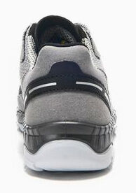 The image shows the rear view of a gray sports shoe. It has a smooth, black sole and a padded upper part with white and black accents.