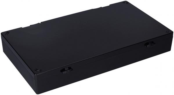 The image shows a rectangular, flat black box. It has rounded corners and some indentations on the sides, likely for handling. The surface is smooth and unobtrusive.