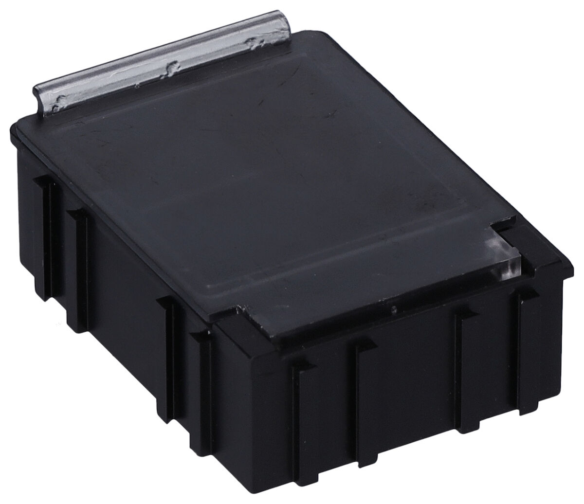 The image shows a rectangular black casing with a smooth surface and a transparent lid. It has a textured bottom with small indentations.