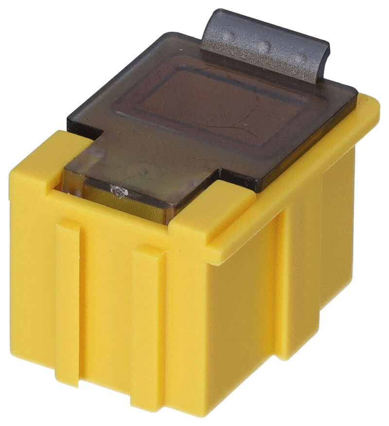 The image shows a yellow plastic plug with a transparent top part and a metal clip. The plug has straight edges and vertical grooves on the sides.