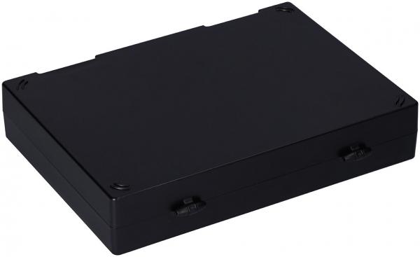 The image shows a flat, rectangular box in matte black. It has rounded corners and two small handles on the sides for carrying. The surface appears sturdy.