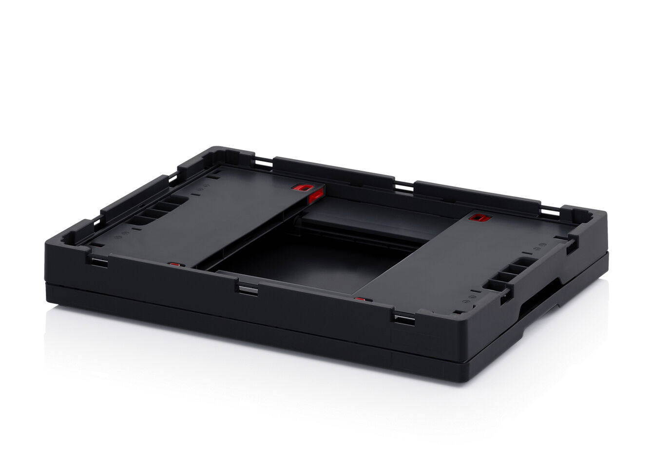 The image shows a black, rectangular holder with cutouts and red markings. It has a flat, sturdy structure and appears functional, possibly for technical devices.