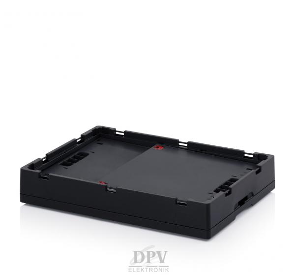 The image shows a black, rectangular plastic tray with a flat bottom and slightly raised edges. The surface is smooth, with small indentations and red markings.