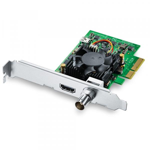 The image shows a computer graphics card. It has a green circuit board with black and silver components. A cooler and two connection sockets are clearly visible. The card is designed for internal use.