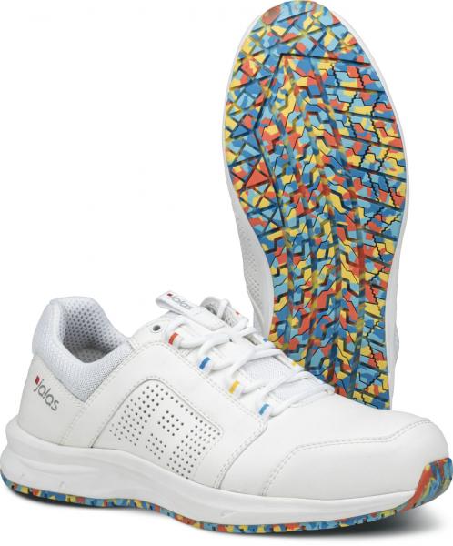 The image shows a white sports shoe with a breathable upper. The sole features a colorful, geometric pattern in blue, red, and yellow that ensures good grip.